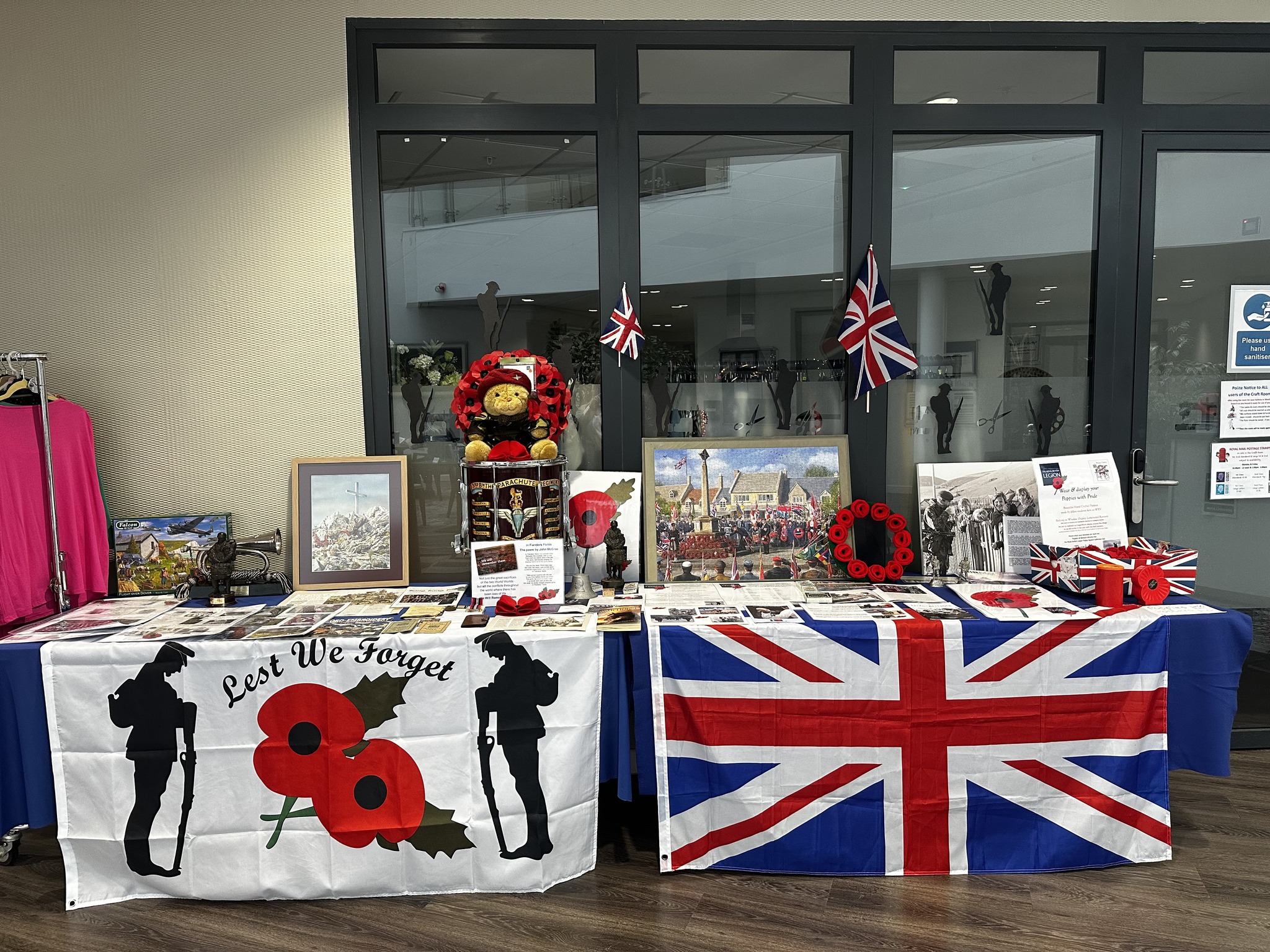 Wixams remembrance day table with flags and memorabilia on display.