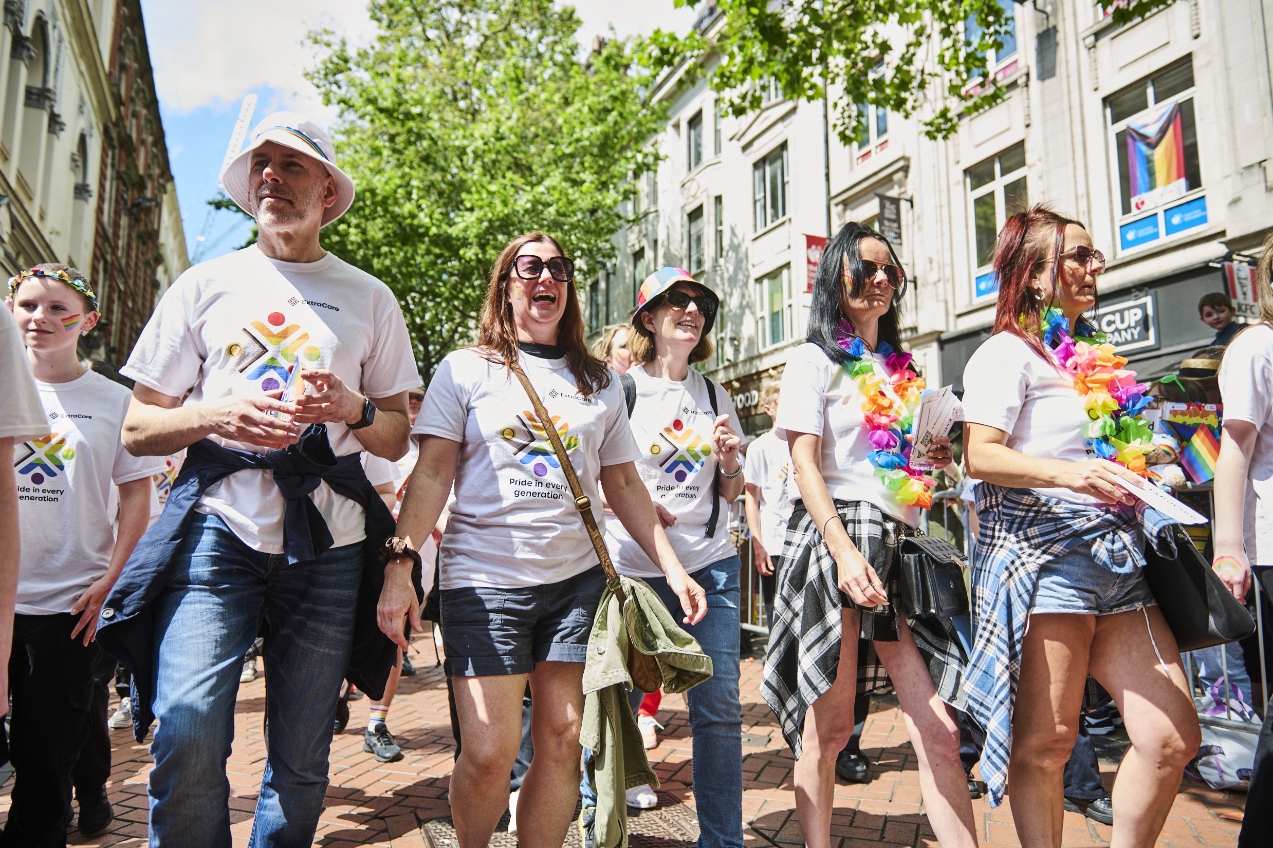 ExtraCare pride group walking through the city.