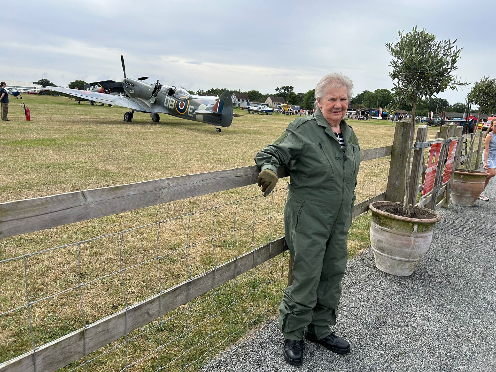 Doreen at the air field with the spitfire in the background.