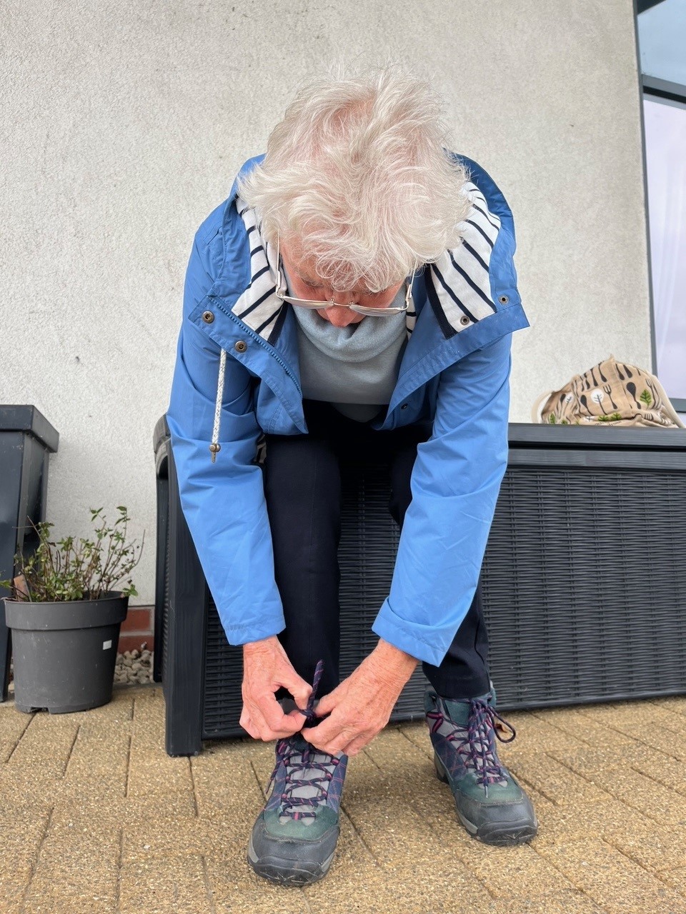 Christine lacing up her boots.